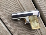 BROWNING BABY BELGIUM, 25 AUTO, BRIGHT NICKEL, WITH GOLD TRIGGER, PEARLITE GRIPS, ALL FACTORY ORIGINAL - 1 of 2