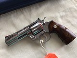 COLT PYTHON 357 MAGNUM “ELITE” 4” BARREL, BRIGHT STAINLESS, NEW UNFIRED IN THE BOX WITH OWNERS MANUAL, HANG TAG, COLT
LETTER, ETC. MFG 2003 - 3 of 4