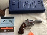 COLT PYTHON 357 MAGNUM “ELITE” 4” BARREL, BRIGHT STAINLESS, NEW UNFIRED IN THE BOX WITH OWNERS MANUAL, HANG TAG, COLT
LETTER, ETC. MFG 2003