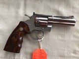 COLT PYTHON 357 MAGNUM “ELITE” 4” BARREL, BRIGHT STAINLESS, NEW UNFIRED IN THE BOX WITH OWNERS MANUAL, HANG TAG, COLT
LETTER, ETC. MFG 2003 - 2 of 4