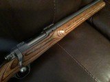 RUGER 77 MARK II, 223 CAL., 26” HEAVY BARREL, GRAYED STAINLESS ACTION WITH BROWN LAMINATE STOCK 99+% COND. - 9 of 9