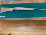RUGER 77/22 ALL WEATHER 22 MAGNUM, GRAYED STAINLESS, BROWN LAMINATE STOCK, 99% COND.I