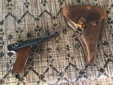 GERMAN LUGER 9MM, MFG. 1937, HAS MATCHING NUMBERS ON THE GUN, HOLSTER HAS 1934. HAS TOOL INSIDE HOLSTER FLAP. - 1 of 5
