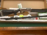 REMINGTON 1100 COMPETITION SYNTHETIC TARGET, 12 GA., 30” WIDE VENT RIB, WITH 5 PROBORE CHOKE TUBES, LIKE NEW IN THE BOX - 1 of 5