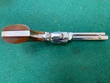COLT FRONTIER SCOUT 22 LR., 4 3/4” BARREL,
BRIGHT
NICKEL, APPEARS UNFIRED, 99+% COND. - 3 of 4