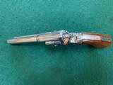COLT FRONTIER SCOUT 22 LR., 4 3/4” BARREL,
BRIGHT
NICKEL, APPEARS UNFIRED, 99+% COND. - 4 of 4