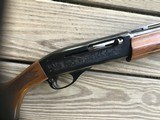 REMINGTON 1100, 410 GA., 25” MOD. VENT RIB, FACTORY ENGRAVED RECEIVER WITH QUAIL & POINTER ON ONE SIDE, SETTER & QUAIL ON THE OTHER SIDE, 99+% COND. - 4 of 8