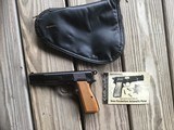 BROWNING BELGIUM HI POWER 9 MM, 1969 MFG., RING HAMMER, NEW, APPEARS UNFIRED 100% COND. IN THE ZIPPER BROWNING CASE WITH OWNERS MANUAL - 1 of 3