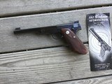 COLT WOODSMAN BULLSEYE MATCH TARGET 22 LR. MFG. 1940, FACTORY ELEPHANT EAR GRIPS, COMES WITH OWNERS MANUAL - 1 of 4