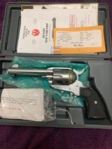 RUGER VAQUERO NEW MODEL GLOSS STAINLESS 45 COLT, 4 5/8” BARREL, LIKE NEW IN THE BOX WITH OWNERS MANUAL ETC.