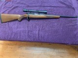 RUGER 77/22, 22 LR., COMES WITH WEAVER 4X SCOPE, 99% COND.