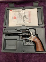 RUGER VAQUERO BISLEY OLD MODEL, 45 LC. CAL. CASE COLOR FRAME, BLUE BARREL & CYLINDER, EXC. COND. IN THE BOX WITH OWNERS MANUAL