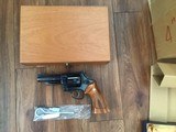 SMITH & WESSON 25-5, 45 LC. CAL., RARE 4” BLUE, NEW UNFIRED IN THE BLUE BOX, SMITH WOOD PRESENTATION CASE, CLEANING TOOLS IN PLASTIC & SHIPPING CARTON