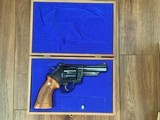 SMITH & WESSON 25-5, 45 LC. CAL., RARE 4” BLUE, NEW UNFIRED IN THE BLUE BOX, SMITH WOOD PRESENTATION CASE, CLEANING TOOLS IN PLASTIC & SHIPPING CARTON - 2 of 4