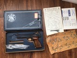 SMITH & WESSON 41 NO DASH, 22 LR., 5 1/2” BARREL, NEW UNFIRED IN THE BOX WITH OWNERS MANUAL, CLEANING TOOLS IN PLASTIC, OIL PAPER ETC. - 1 of 9