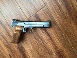 SMITH & WESSON 41 NO DASH, 22 LR., 5 1/2” BARREL, NEW UNFIRED IN THE BOX WITH OWNERS MANUAL, CLEANING TOOLS IN PLASTIC, OIL PAPER ETC. - 3 of 9