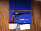 SMITH & WESSON 57 NO DASH, 41 MAGNUM, 8 3/8” BLUE, AS NEW IN THE WOOD PRESENTATION CASE WITH CLEANING TOOLS, OWNERS MANUAL, ETC.