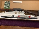 REMINGTON 1100 SPORTING,12 GA., 28” REM CHOKE,HIGH GLOSS WALNUT,
NEW UNFIRED IN THE BOX WITH OWNERS MANUAL, 3 CHOKE TUBES & WRENCH - 1 of 6