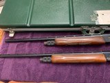 REMINGTON 1100 MATCHED SKEET SET, 28 GA. & 410, MFG. 1969, 25” SKEET CHOKES, EXC. COND. COMES IN ORIGINAL REMINGTON GREEN CASE WITH WEIGHTS - 5 of 5