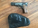 BROWNING
BELGIUM, HIGH POWER 9 MM, RING HAMMER, MFG. 1969, NEW 100% COND. IN THE BROWNING ZIPPER POUCH
