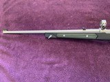 RUGER 77/22, 22 LR., BOAT PADDLE WITH GREEN INSERTS 99% COND.
