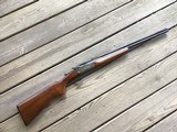 SAVAGE 24, 22 LR. OVER 410 GA. DESIRABLE MODEL WITH SIDE BUTTON BARREL SELECTOR, CASE COLORED RECEIVER & WALNUT WOOD, EXC. COND.