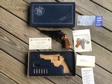 SMITH & WESSON 53-2, 22 MAGNUM, RARE 4” BARREL, TARGET GRIPS, LIKE NEW IN THE BOX WITH 22 JET INSERTS, OWNERS MANUAL, ETC.