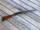 SAVAGE 24, 22 LR. OVER 410 GA., OLER MODEL WITH DESIRABLE SIDE BUTTON SELECTOR, FACTORY CHECKERED WALNUT WOOD, CASE COLORED RECEIVER, 99% COND.