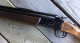 SAVAGE 24 DLX., 22 LR. OVER 20 GA., BLUE ENGRAVED RECEIVER WITH RED FOX ON ONE SIDE & GROUSE IN FLIGHT ON THE OTHER SIDE - 6 of 9