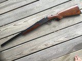 SAVAGE 24, 22 LR. OVER 410 GA., OLDER MODEL WITH POPULAR SIDE BUTTON BARREL SELECTOR & WALNUT WOOD