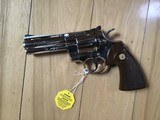 COLT PYTHON 357 MAGNUM, BRIGHT NICKEL 4” BARREL, NEW UNFIRED IN THE BOX WITH OWNERS MANUAL, HANG TAG, COLT LETTER, ETC. MFG 1972