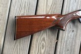 REMINGTON 1100 410 GA., 25” MOD. CHOKE, VENT RIB, 3” CHAMBER, SHOOTS 2 1/2” or 3” SHELLS, 99% BLUE, WITH SOME HANDLING MARKS IN THE WOOD - 2 of 10