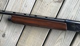 REMINGTON 1100 410 GA., 25” MOD. CHOKE, VENT RIB, 3” CHAMBER, SHOOTS 2 1/2” or 3” SHELLS, 99% BLUE, WITH SOME HANDLING MARKS IN THE WOOD - 9 of 10