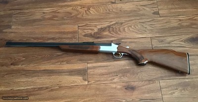 SAVAGE 24 DLX. 22 LR. OVER 410 GA. SATIN SILVER ENGRAVED RECEIVER WITH RED FOX ON ONE SIDE & GROUSE IN FLIGHT ON THE OTHER SIDE, EXC. COND.