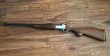 SAVAGE 24 DLX. 22 LR. OVER 410 GA. SATIN SILVER ENGRAVED RECEIVER WITH RED FOX ON ONE SIDE & GROUSE IN FLIGHT ON THE OTHER SIDE, EXC. COND. - 1 of 10