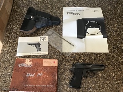 WALTHER PP 9MM CAL. GERMAN MFG. IN THE BOX WITH OWNERS MANUAL, TEST TARGET, CLEANING TOOL, APPEARS UNFIRED WITHOUT A MARK ON IT