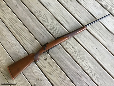 RUGER 77, 243 CAL. EARLY MFG. WITH RED RECOIL PAD, 99% COND.