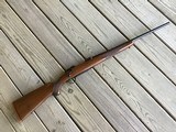 RUGER 77, 243 CAL. EARLY MFG. WITH RED RECOIL PAD, 99% COND.