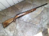 WEATHERBY XII, MADE IN ITALY, 22 LR. BEAUTIFUL BLOND WOOD 99+% COND.