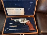 SMITH & WESSON 27-2, RARE 5” BARREL, BRIGHT NICKEL, NEW UNFIRED 100% COND. IN THE SMITH & WESSON WOODEN PRESENTATION CASE WITH OWNERS MANUAL ETC. - Image 1 of 6