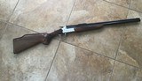 SAVAGE 24 DELUXE 22 LR. OVER 20 GA. GOLD TRIGGER, SATIN SILVER ENGRAVED WITH RED FOX ON ONE SIDE & GROUSE IN FLIGHT ON OTHER SIDE, EXC. COND. - Image 1 of 8