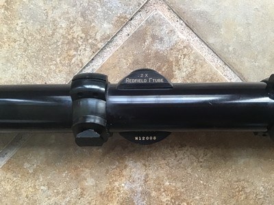 REDFIELD 2X 1” TUBE RIFLE SCOPE WITH FINE CROSS HAIRS RETICLE, COMES WITH REDFIELD RINGS, HAS FLIP UP SEE THRU LENS COVERS, NEW COND. - Image 2 of 3