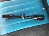 BUSHNELL SPORTSMAN 4X-12X AO, DUPLEX CROSS HAIS RETICLE, WATERPROOF, AS NEW INSIDE & OUT - Image 1 of 3