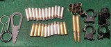 .38 Special, .357 HP, scope mounts (2), .44 mag cases, military tools. - 1 of 3