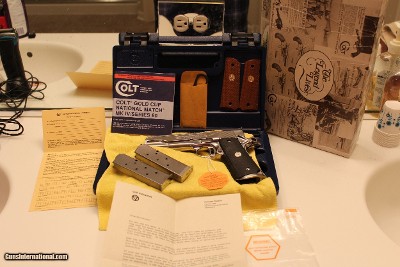 1989 COLT 1911 45 ACP. GOLD CUP NATIONAL MATCH ENHANCED,,, WITH ALL FACTORY BOX AND CASE AND PAPER WORK ONE OWNER SUPER COLLECTABLE AWSOME ALL O.E.M.