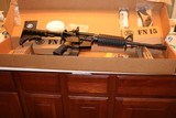 FN 15 CARBINE ALLOY/BLACK
5.56 X 45 16 INCH BARREL 30 ROUND MAG,, NEW ONLY OUT OF PLASTIC FOR PICTURES AWSOME SET UP,,,, - 6 of 13