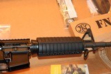 FN 15 CARBINE ALLOY/BLACK
5.56 X 45 16 INCH BARREL 30 ROUND MAG,, NEW ONLY OUT OF PLASTIC FOR PICTURES AWSOME SET UP,,,, - 9 of 13