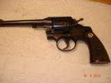 Colt Official Police .22Caliber 6" BBl. MFG 1953 Excellent in Original box Test target, Brush Handling the Handgun - 7 of 13