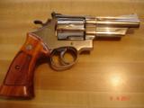S&W Mod.57 No dash Bright Nickel 4"BBl. MINT in Presentation case MFG 1976 Papers and tools - 4 of 10