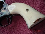 USFA Premium SA B&C 7 1/2"BBl.
.45 Colt
Excellent in Box , papers ,Sock Original Blk. Stocks and a Beautiful
Set of Elk Stags Stocks. - 9 of 13